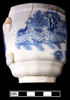 Refined white earthenware panelled and handled cup with printed underglaze decoration in Chinese pattern. Vessel height: 3.25”, Lot:  18BC27/339.